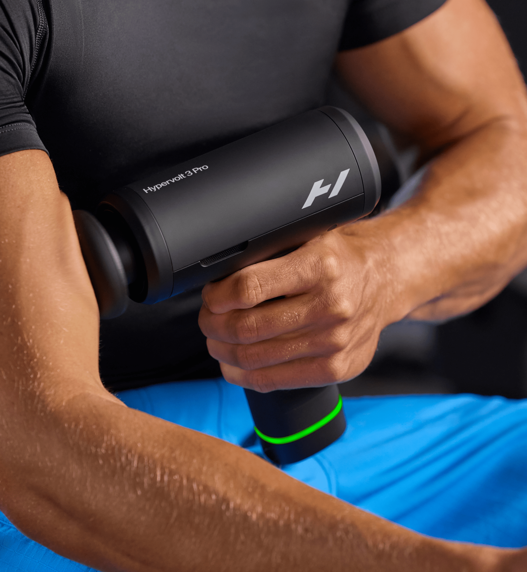 Person using a Hypervolt 3 Pro massage gun on their arm