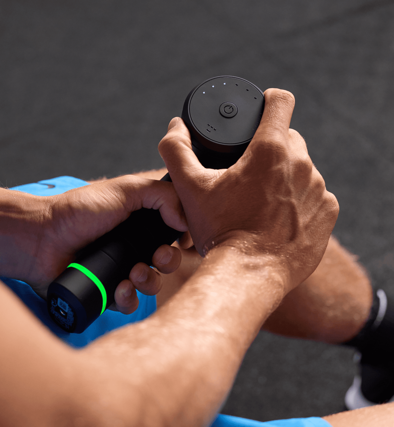 Person adjusting the speed dial on their Hypervolt 3 Pro