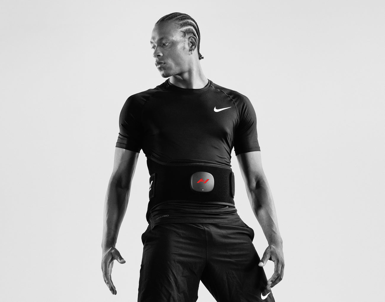 Person wearing a black athletic outfit with a Venom 2 Back on, on a white background