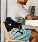 Person wearing a venom 2 back on their back while sitting at a desk.